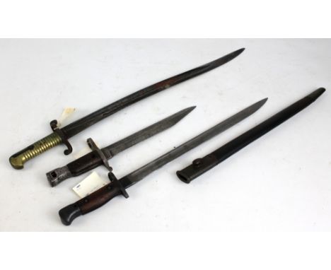 Two British bayonets comprising straight bladed example dated 1907 with broad arrow marks to blade base in metal mounted leat