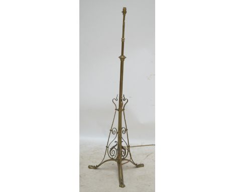 An early 20th century adjustable brass standard lamp.