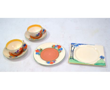 CLARICE CLIFF; a Bizarre ware 'Crocus' pattern tea trio and a matching cup and saucer, Newport Pottery, also a The Biarritz s