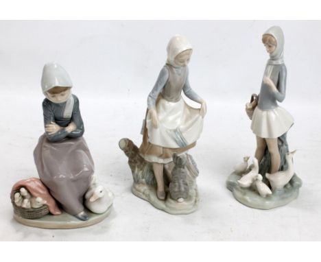 Three Lladro figures to include girl with geese and girl with a hare (3). CONDITION REPORT: Standing girl missing item from l