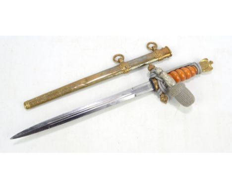 A German Third Reich Kriegsmarine dagger with lightning bolt scabbard, wirework portepee and bound orange grip, the blade ins