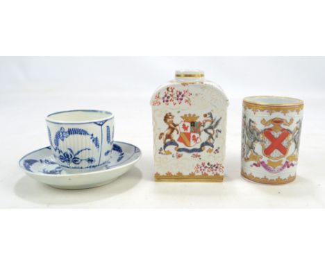 A late 19th century Samson porcelain cylindrical mug painted with coat of arms on floral spray ground, a similar tea caddy, a