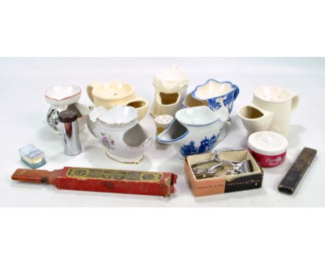 A group of ceramic shaving mugs including Mason's and Wade examples, a cased razor and further shaving accessories.