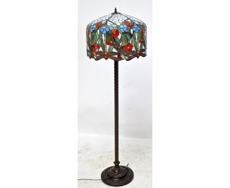 A metal three bulb fitting standard lamp with large resin Tiffany-style dragonfly motif shade, height approx 160cm.