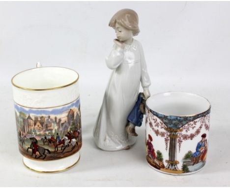 A Nao figure of a young girl holding a clown doll, a Coalport mug and a further transfer decorated mug (3).