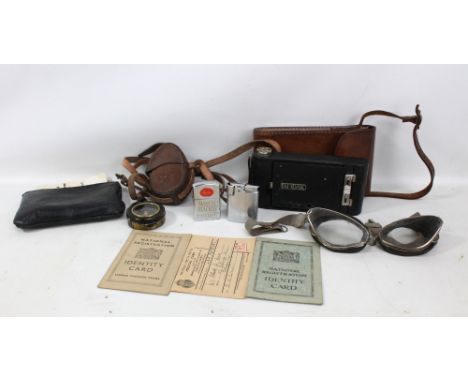 A small group of various items including cased a WWI military issue Verner's patterned lacquered brass compass, a pair of gog
