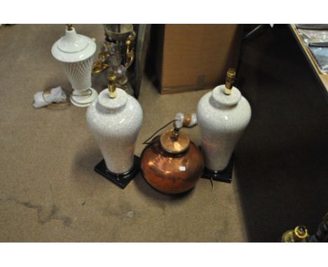 A modern beaten copper lamp base, height 36cm, and a pair of speckled porcelain baluster examples and a further example (4).