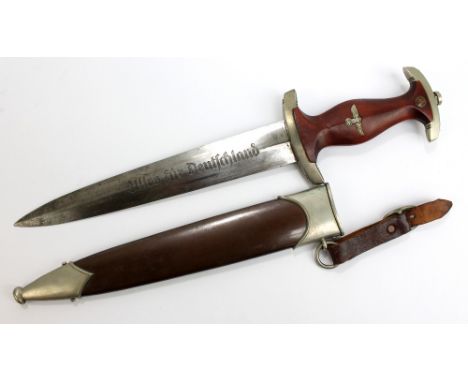 A WWII SA dagger with mahogany and brass mounted handle, with Solingen blade inscribed 'Alles für Deutschland', length 22cm, 