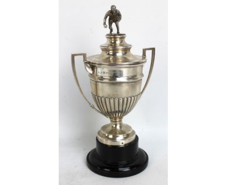 JOSEPH GLOSTER LTD; a George V hallmarked silver bowling trophy with angled twin handles and part gadrooned decoration, with 