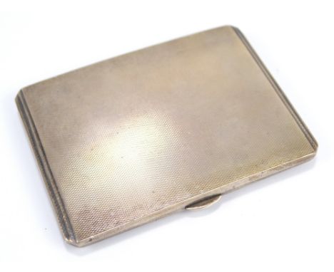 EJ TREVITT & SONS LTD; a George VI hallmarked silver rectangular engine turned decorated cigarette case, engraved with presen