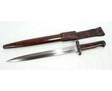 A WWI bayonet with Wilkinson of London blade and leather scabbard, overall length 46.5cm. CONDITION REPORT: No stamps or mark