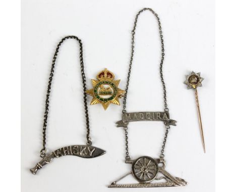 A 15ct yellow gold and enamel Manchester regiment badge, approx 9.4g, and a yellow and white metal Manchester regiment stick/