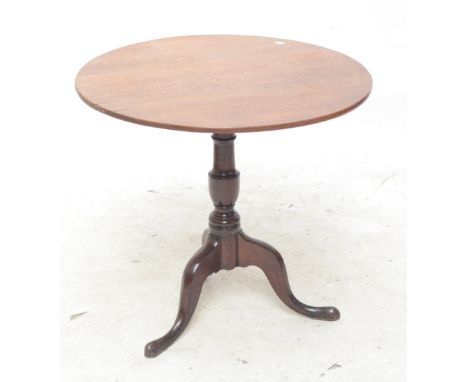 An oak tripod table, diameter 77cm.