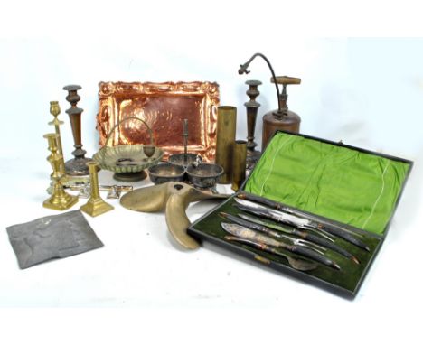 A mixed group of metalware including cased antler handled carving set with hallmarked silver collars, brass candlesticks, a D