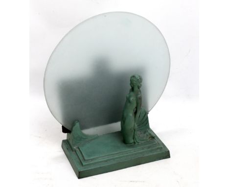 An Art Deco green painted metal figural lamp base depicting a kneeling female nude on stepped rectangular base, height 32.5cm