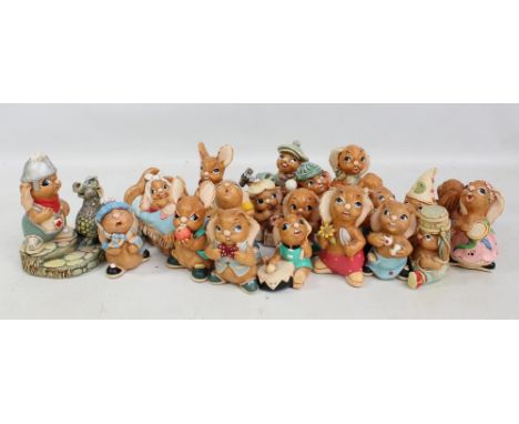 Twenty Pendelfin rabbits including 'Georgie & The Dragon', 'Sweep', 'Duffy', 'Scrumpy', 'Tippit', etc. 