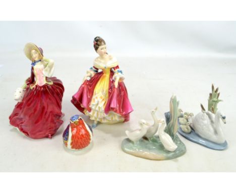 Two Royal Doulton figures; HN1934 'Autumn Breezes', and HN2229 'Southern Belle', a Royal Crown Derby paperweight in the form 