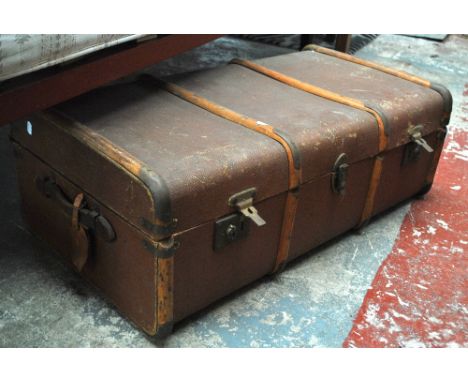 A vintage wood bound canvas covered twin handled travel trunk, 90 x 50 x 30cm.