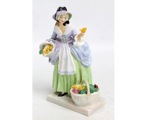 A Royal Doulton figure; HN1807 'Springflowers', height 18.4cm. CONDITION REPORT: Two very small chips to one of the flowers i