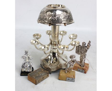 A small Judaica related lot including a figure of 'Fiddler of the Roof' and 'Moses', and an unusual circular Hanukkah lamp (5