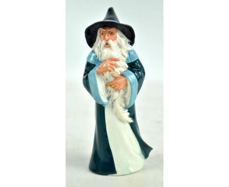 A Royal Doulton figure; HN2911 'Gandalf', height 17.7cm. CONDITION REPORT: Light surface pitting but ok.