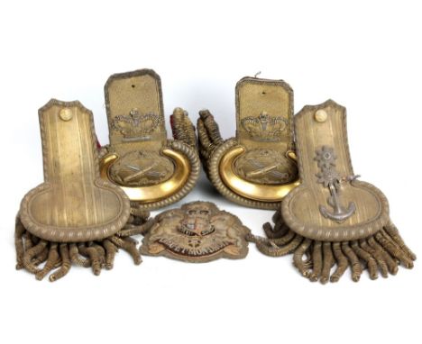 A pair of bullion work epaulettes with crown above sword and scabbard device and red velvet lining to interior (lacking butto