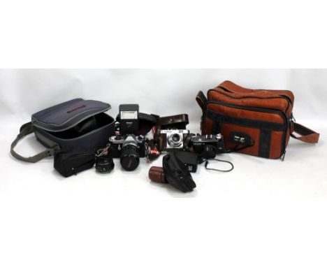 A Pentax 'ME Super' camera in leather case with accessories and manual, in fitted bag, also Hanimex and Voigtländer examples 