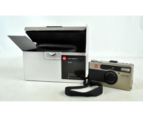 LEICA; a Minilux 18006 comprising camera body with shutter stamped 'Summarit 1:2.4/40mm' with attached fabric strap and instr