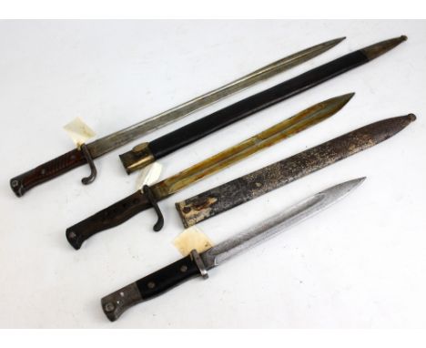 Three German bayonets, the first stamped 'Ljung & S Shul' in metal mounted leather scabbard, the second stamped 'Frister & Ro