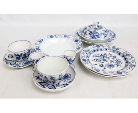 A small collection of Meissen porcelain 'Onion' pattern wares including muffin dish, two plates, two bowls, two saucers (one 