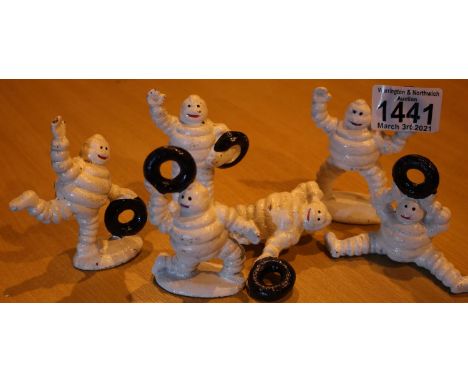 Six miniature cast iron Michelin Man figures, largest H: 9 cm. P&amp;P Group 2 (£18+VAT for the first lot and £3+VAT for subs