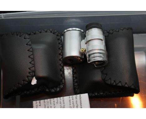 Two new old stock cased 60x currency/jewellery detecting loupes with LED light. P&amp;P Group 1 (£14+VAT for the first lot an
