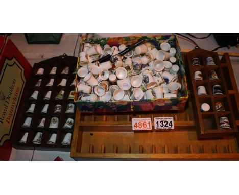 Three wall hanging display mounts and a large collection of ceramic thimbles. Not available for in-house P&amp;P, contact Pau