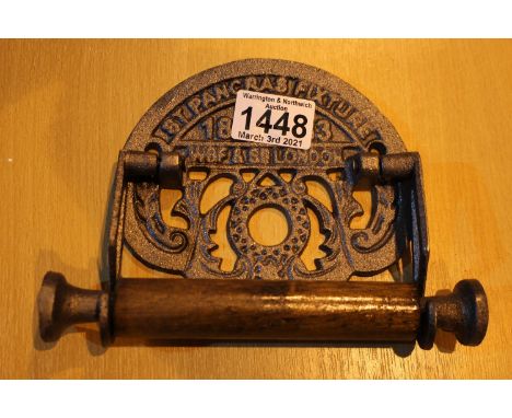 Cast iron St Pancras logo toilet roll holder. P&amp;P Group 2 (£18+VAT for the first lot and £3+VAT for subsequent lots) 