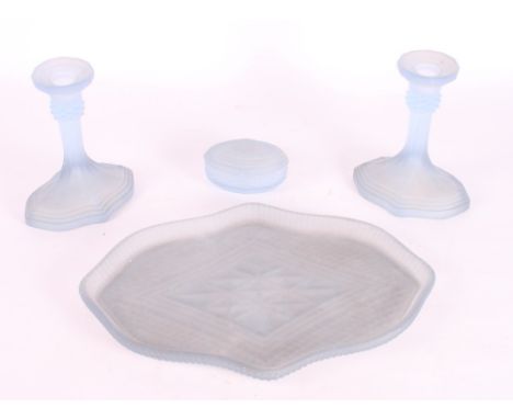 A pair of blue frosted glass candlesticks, a matching tray and a trinket box