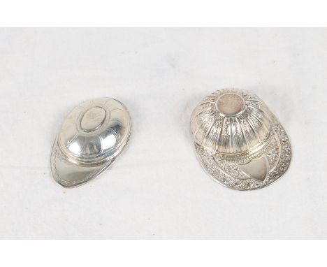 A Georgian silver "jockey cap" caddy spoon with bright cut decoration by Samuel Pemberton and a similar later example