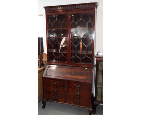 An early 20th Century Georgian design mahogany bureau bookcase enclosed two glazed doors with decorative glazing bars, slopin