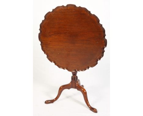 A 19th Century mahogany circular tilt top occasional table with pie crust edge, on tripod base, 28" dia