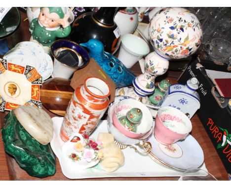 A floral decorated ceramic wig stand, base inscribed "Christian Dior", and other items of decorative china