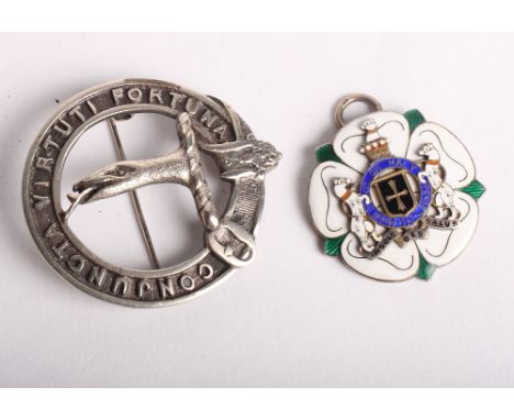 A silver and enamel Masonic jewel and a silver clan badge