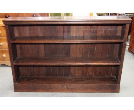 An oak open three-shelf bookcase, 60" wide