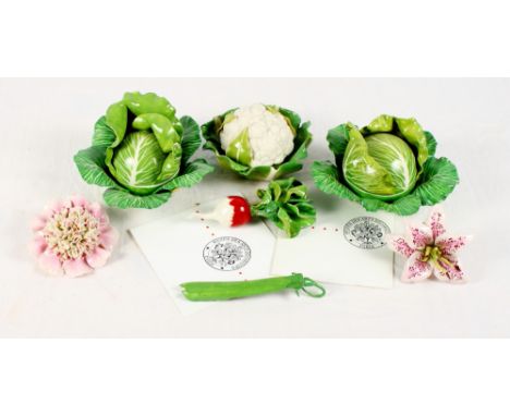 Three ceramic boxes in the form of a cauliflower and cabbage, two similar flowers, a radish and a pea pod