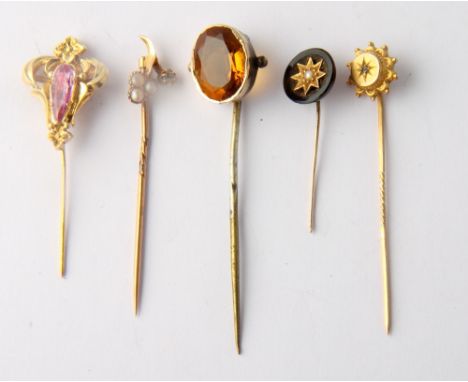 A 15ct gold stick pin and four other stick pins, various