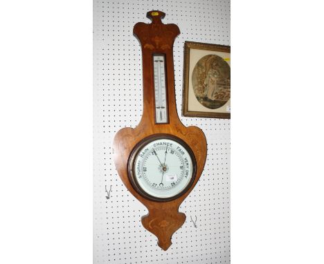 An aneroid barometer in Art Nouveau mahogany case decorated floral marquetry