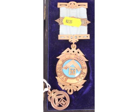 A 9ct gold and enamel Masonic medal from "Strongman Lodge No 45", presentation inscription on reverse dated 1895, and another