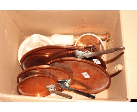 Four copper saucepan lids with iron handles, an "ass's ear" ale mull and three ceramic pestles and mortars