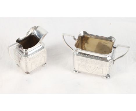 A Victorian silver milk jug with engraved decoration and a matching two-handled sugar basin, 7oz troy approx