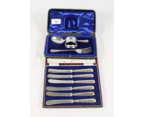 A matched three-piece silver christening set, in case, and a cased set of six tea knives with reed and tie decorated handles