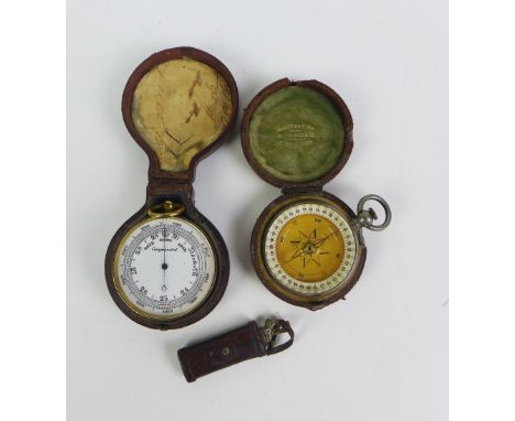 An early 20th century miniature leather golf bag containing a gilt metal file, pocket barometer and a pocket compass, (3) 