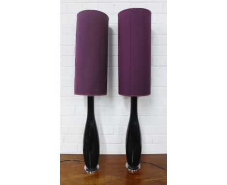 A pair of black glass table lamp bases with purple shades, 56cm high (2)